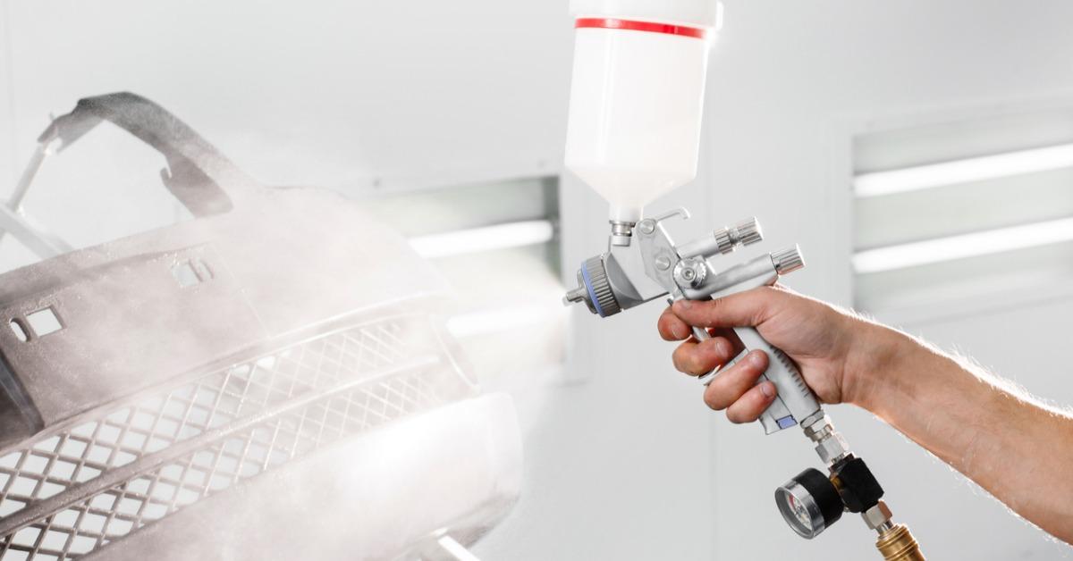 worker painting a car black blank parts in special garage wearing picture id