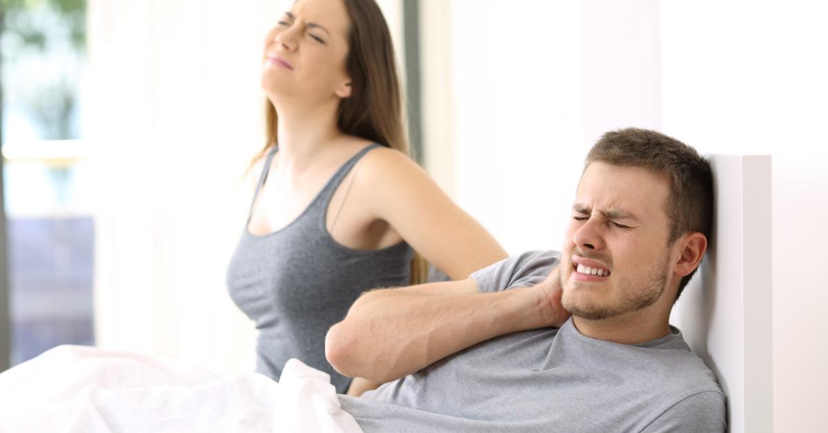 couple suffering ache in a not comfortable bed picture id