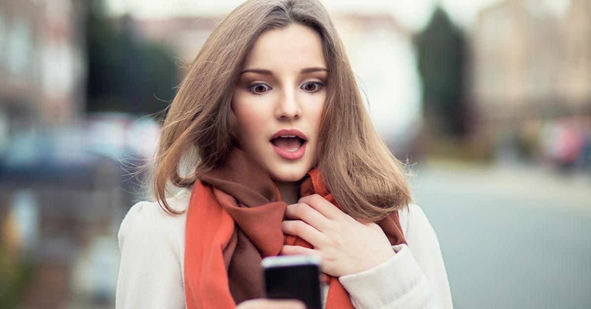 closeup portrait funny shocked anxious scared young girl looking at picture id()