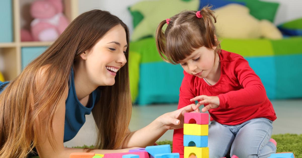 mother and daughter playing with construction toys picture id