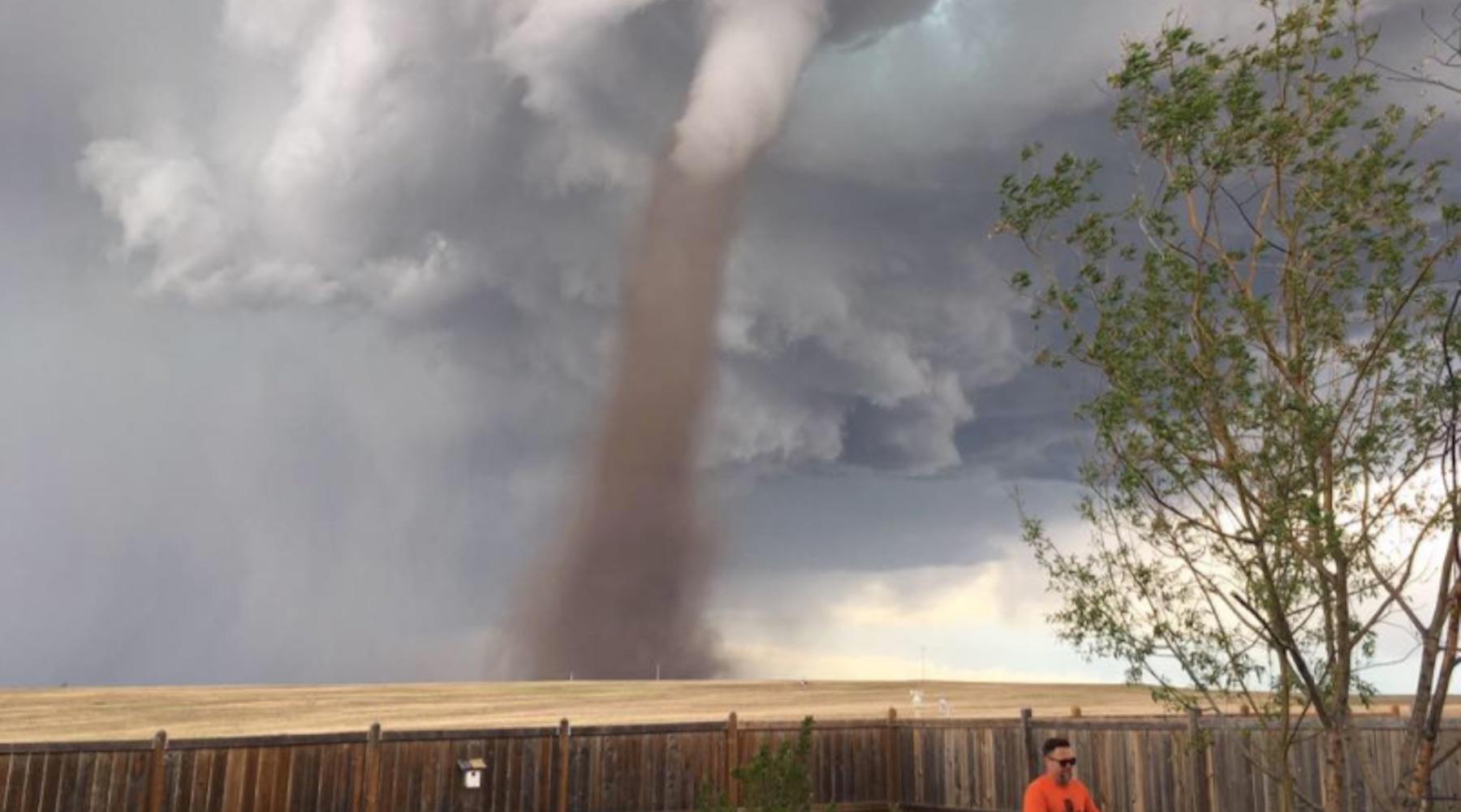 Photo Of A Dad Mowing The Lawn During A Tornado Goes Viral