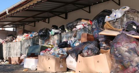 overflowing trash containers picture id