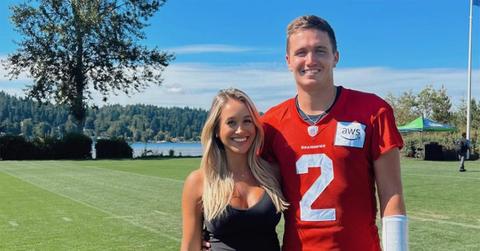 Drew and Natalie Lock on a Seattle practice field.