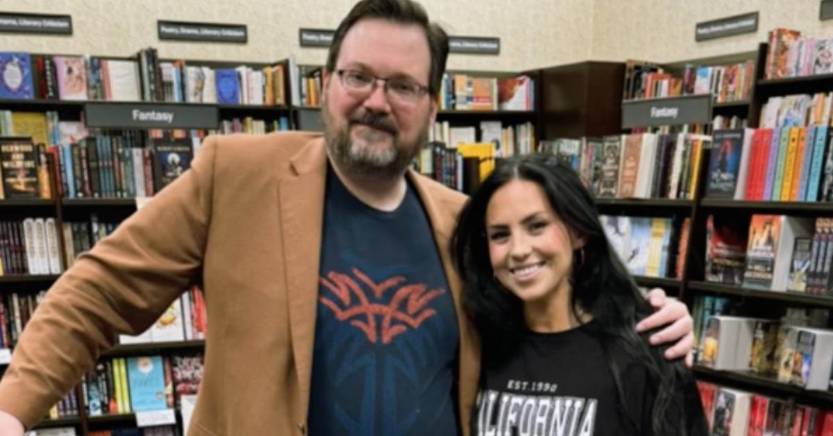 A woman meet author Brandon Sanderson while shopping for his book at Barnes & Noble.