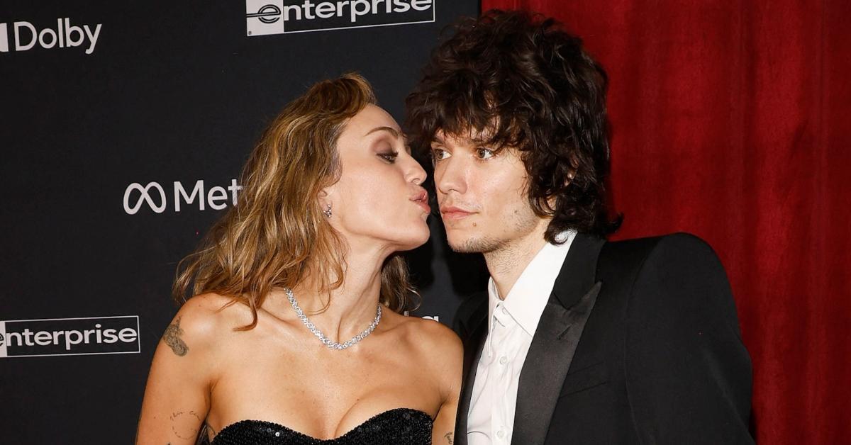 (l-r): Miley Cyrus and Maxx Moronado posing on the red carpet