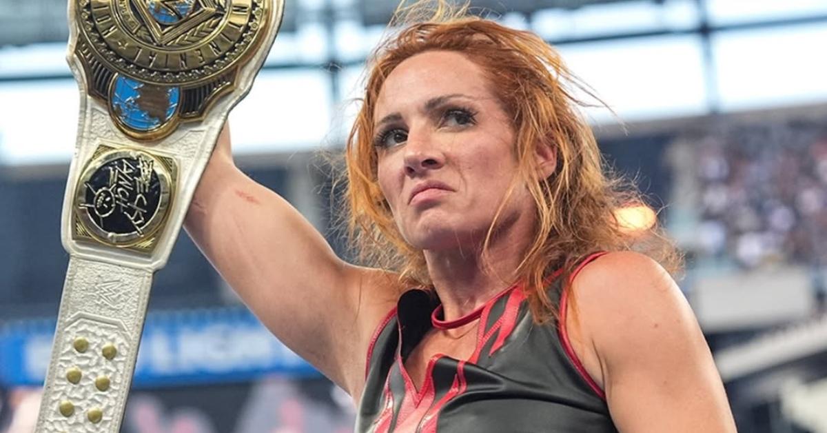 Becky Lynch with her belt in the ring.