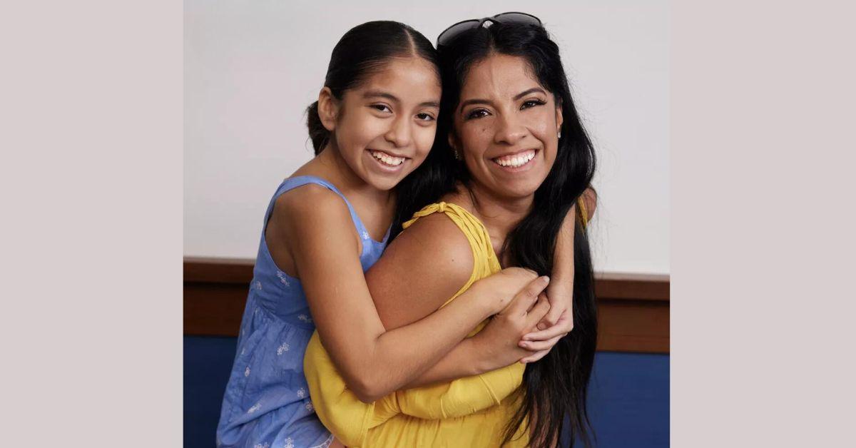 Bellatrix hugs mom Roxce from behind while posing for 'Dance Moms: A New Era' promo photo