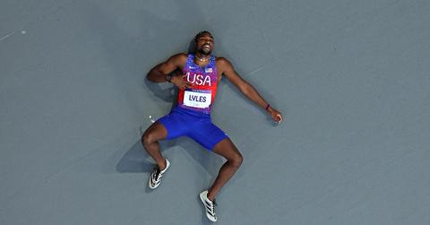 Noah Lyles laying on the track after the 200m final.