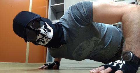 Shadman wearing a skeleton mask doing push ups