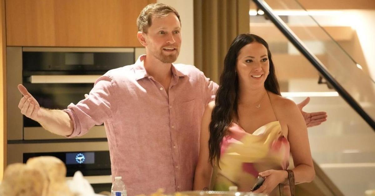 Luke Broderick and Kristen Doute in a kitchen wearing a pink shirt and pink and yellow dress on The Valley