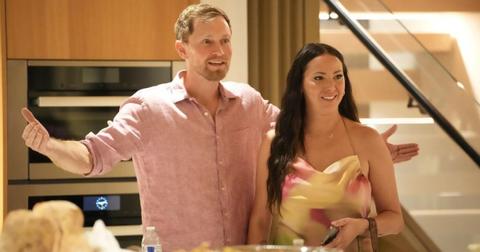 Luke Broderick and Kristen Doute in a kitchen wearing a pink shirt and pink and yellow dress on The Valley