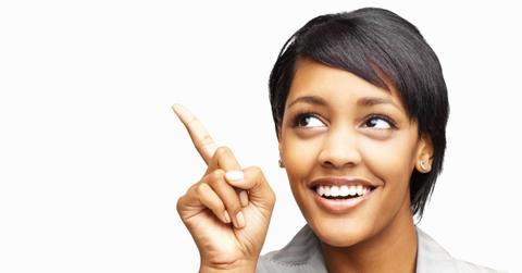 Closeup portrait of a woman pointing upward