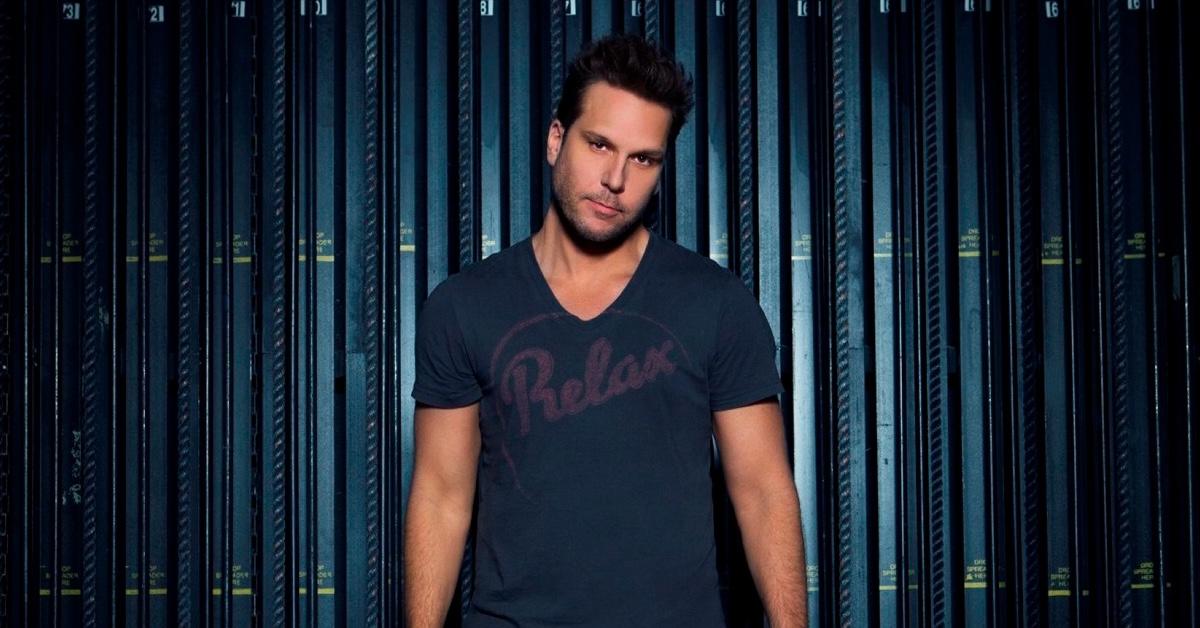 Dane Cook headshot in "Relax" t-shirt