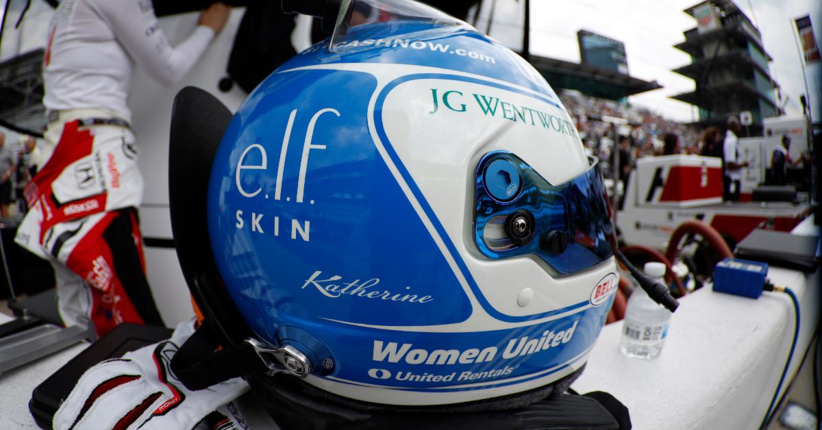 Katherine Legge's helmet features her sponsorships, including e.l.f. skin.