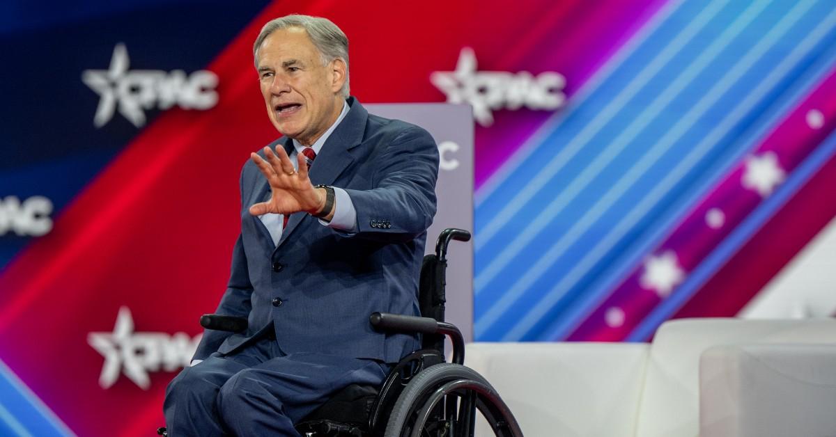 Greg Abbott on stage in his wheelchair. 