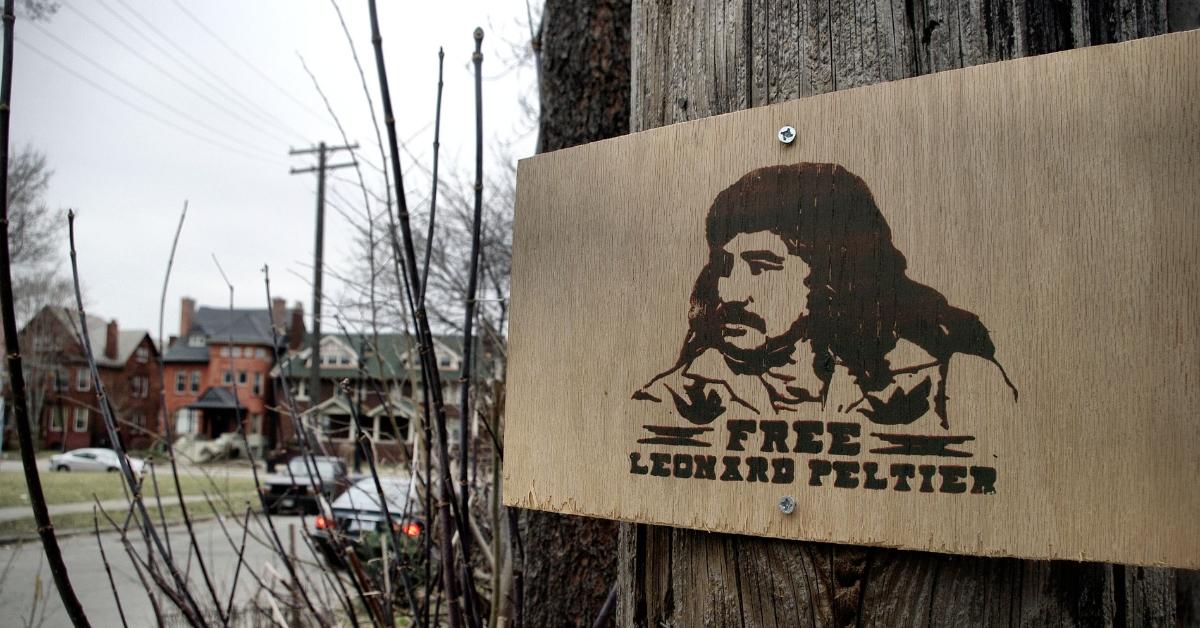 A "Free Leonard Peltier" sign nailed to a telephone pole