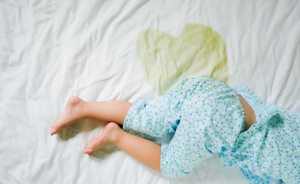 bedwetting child pee on a mattresslittle girl feet and pee in bed picture id