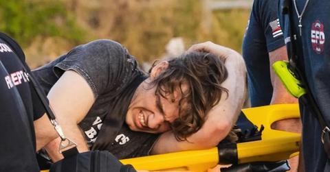 Danny Duncan in pain on a medical stretcher