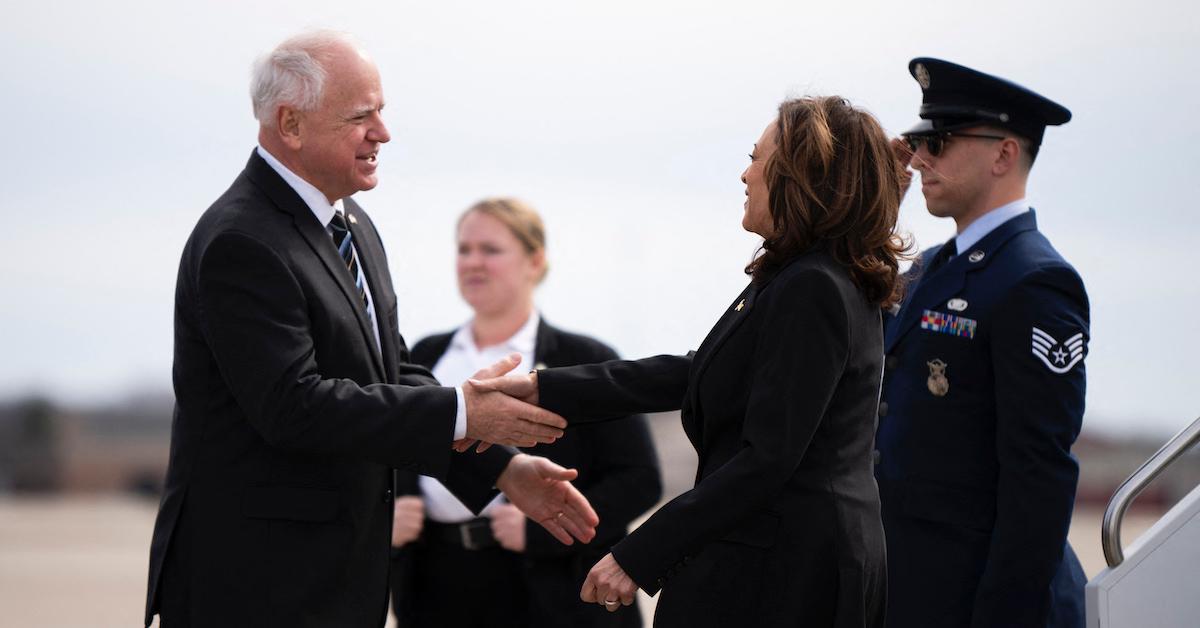 Tim Walz greets US Vice President Kamala Harris as she arrives at the Minneapolis-St. Paul International Airport in Saint Paul, Minnesota, on March 14, 2024.