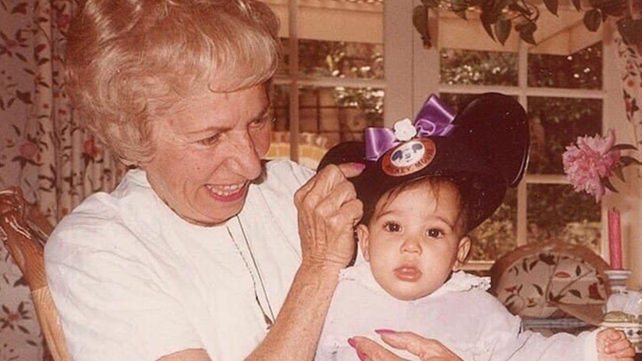 Helen Kardashian holding Kim Kardashian when she was a baby