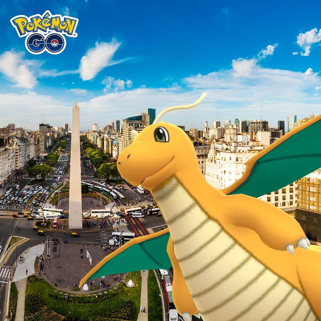 Dragonite in front of a city in Pokémon GO.