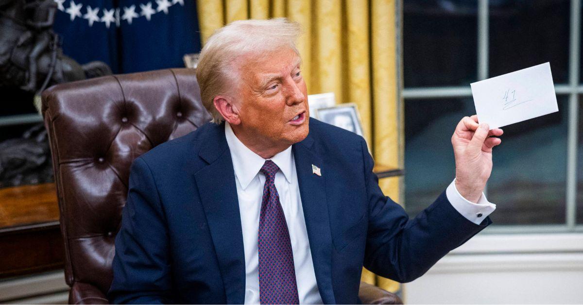 Donald Trump signing executive orders in the White House on Inauguration Day. 