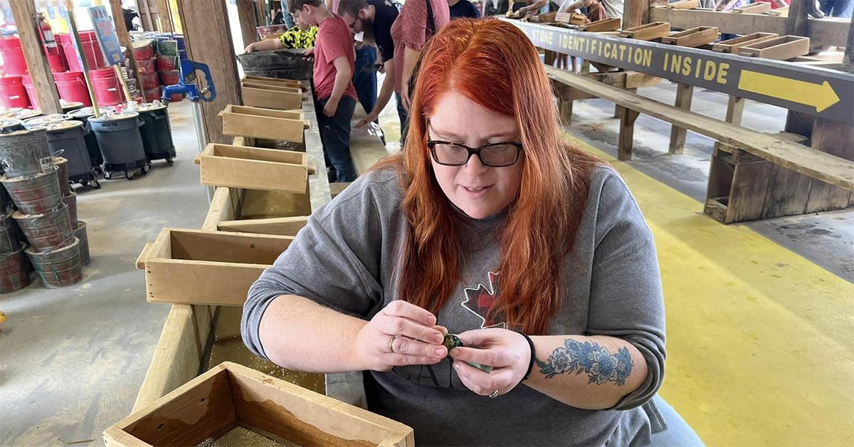 Allison Parliament working on a shelf. 