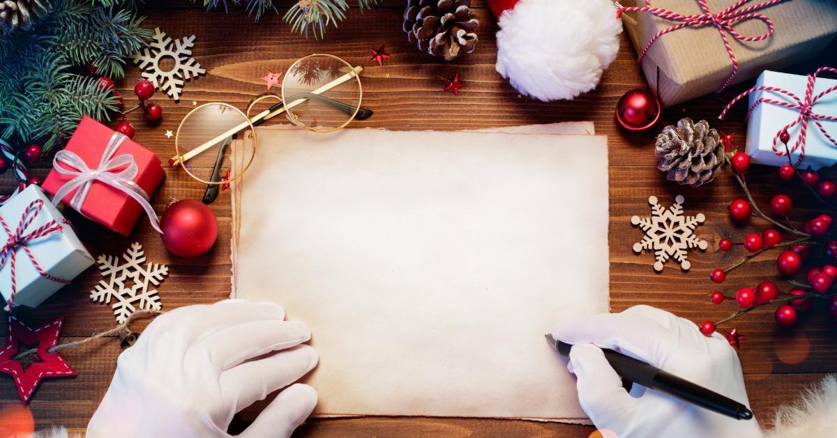 santa claus desk with letter and christmas present picture id