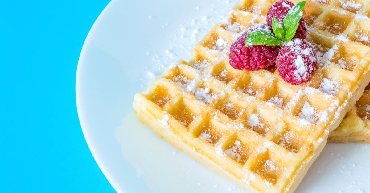 sweet toast waffles with raspberries and a sprig of mint leaves and picture id