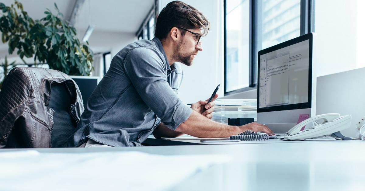 young-businessman-in-office-working-on-computer-picture-id872006502-1536683643483-1536683645413.jpg