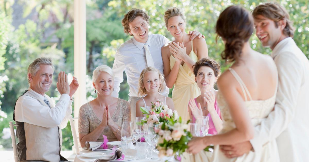 A family celebrates at a wedding.