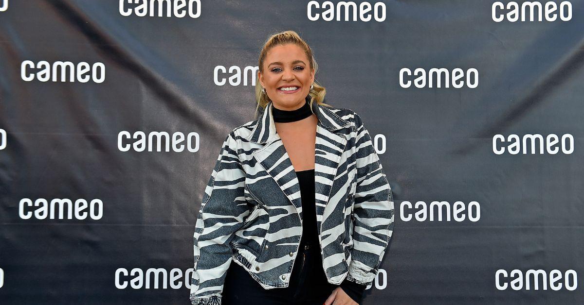 Lauren Alaina smiling at an event.