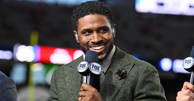 Reggie Bush speaking at a sports event in 2023
