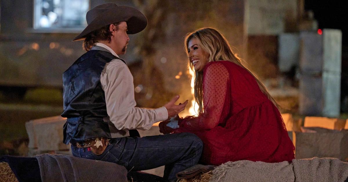 Allen and Cassidy Jo sit by a fire on 'Farmer Wants a Wife'