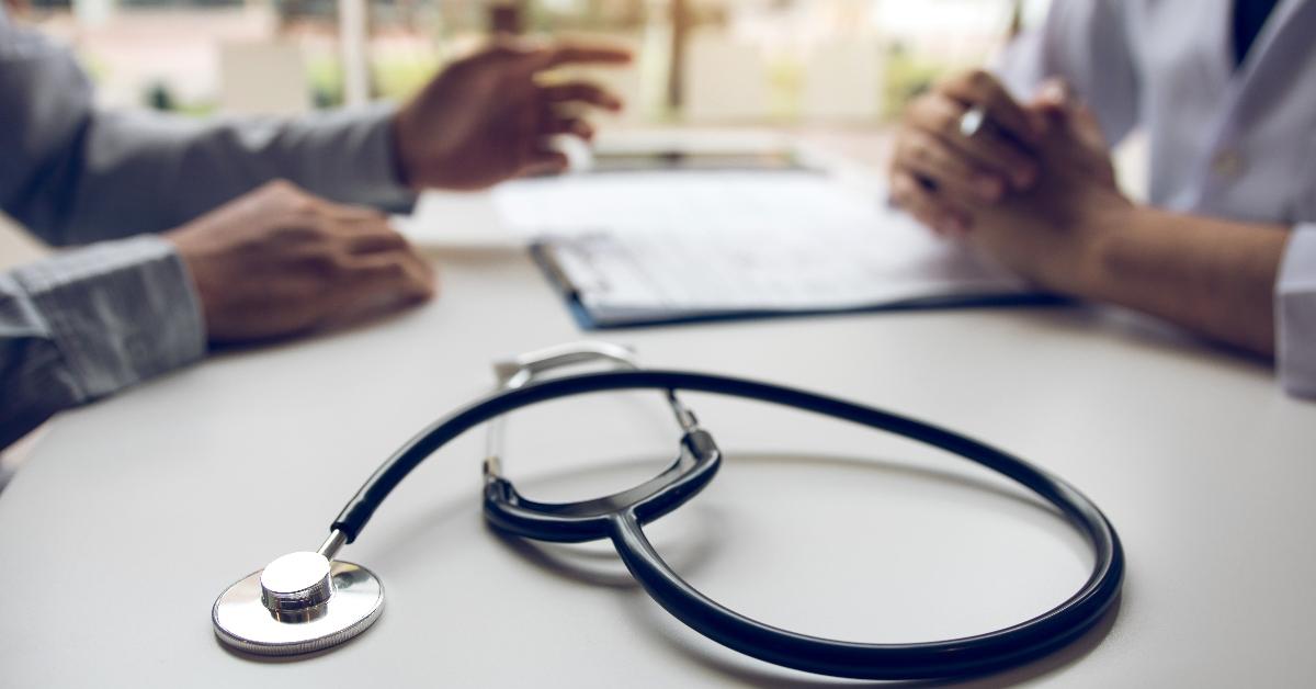 Close up stethoscope and doctor talking the patient at clinic while using the tablet explaining the patient condition and the treatment result. - stock photo