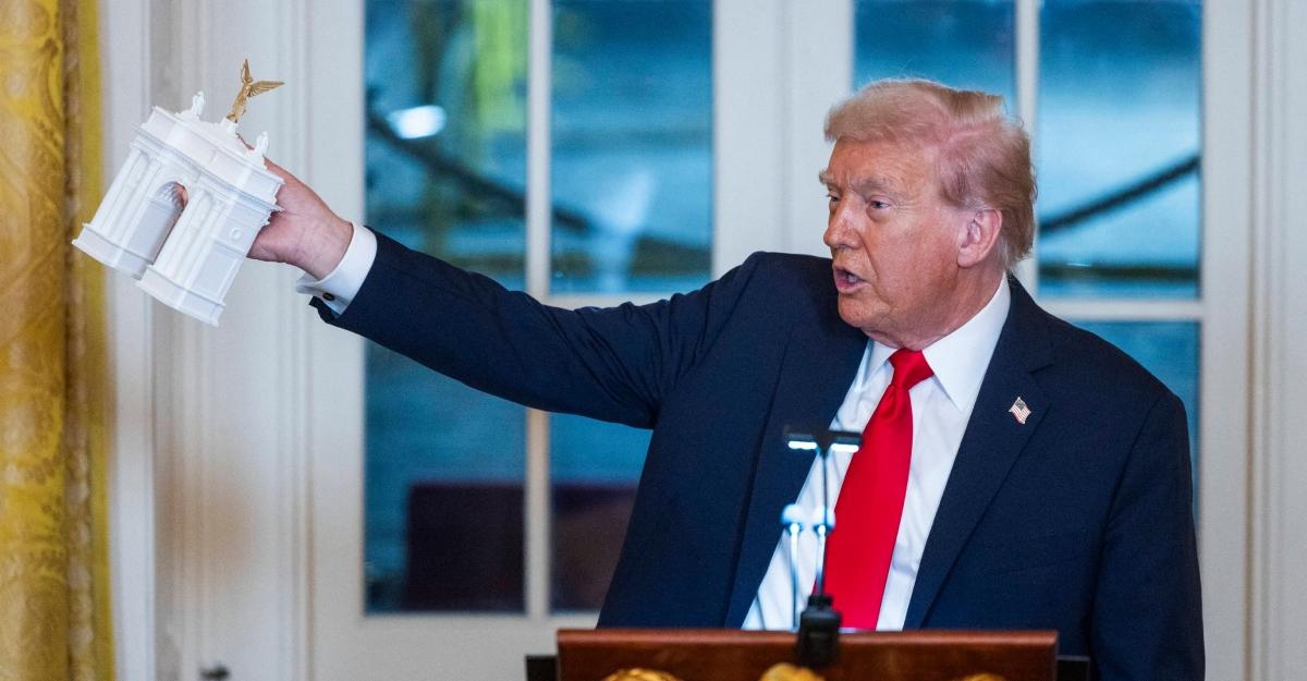 Trump holding Trump Arc
