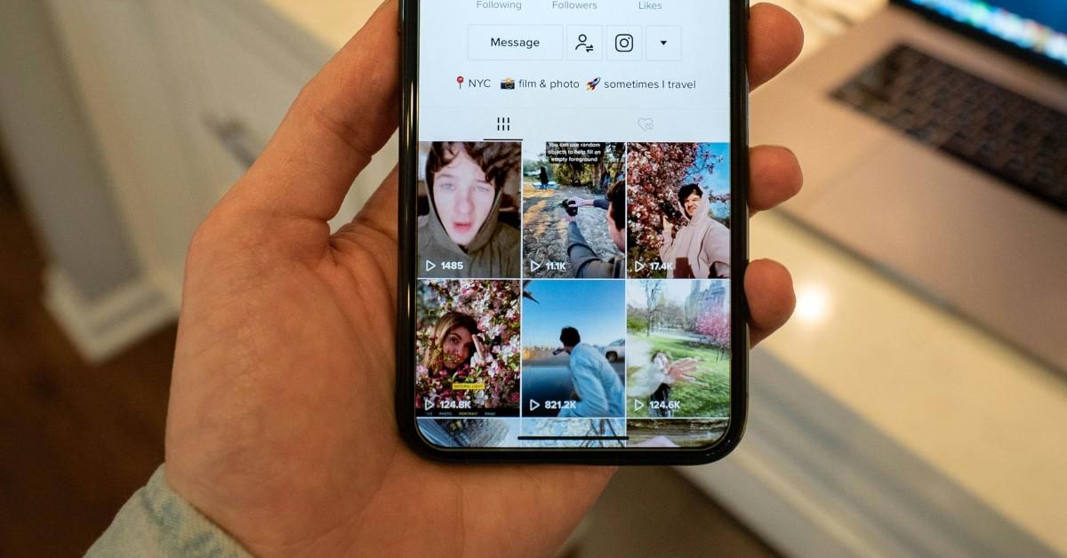 A person on a TikTok profile on their phone