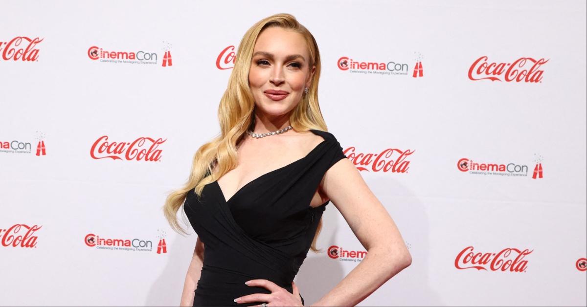Lindsay Lohan poses on the Red Carpet as she attends the 2025 CinemaCon Big Screen Achievement Awards.