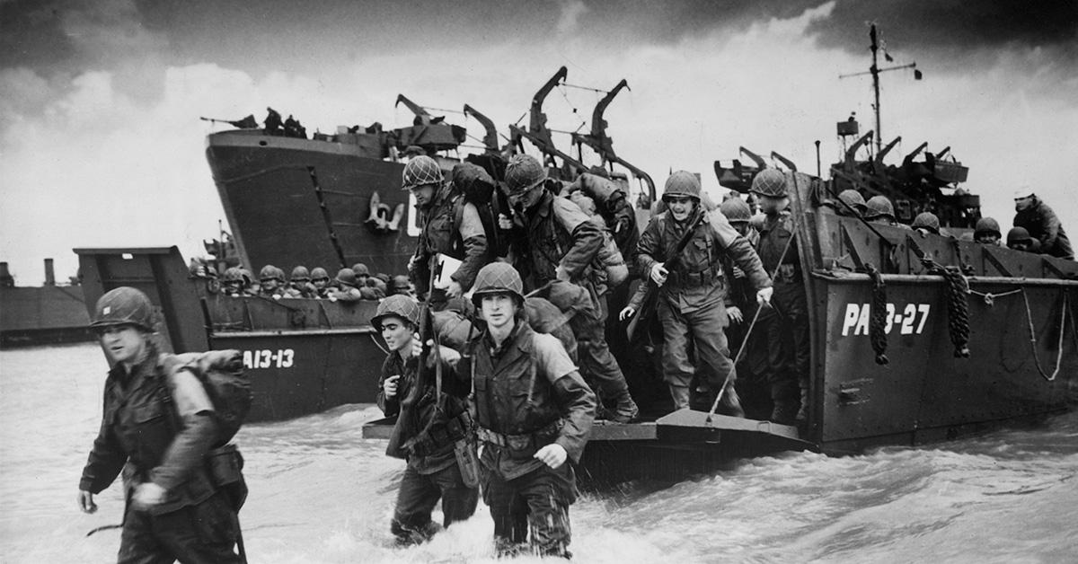 Troops running onto the beach at Normandy on D-Day. 