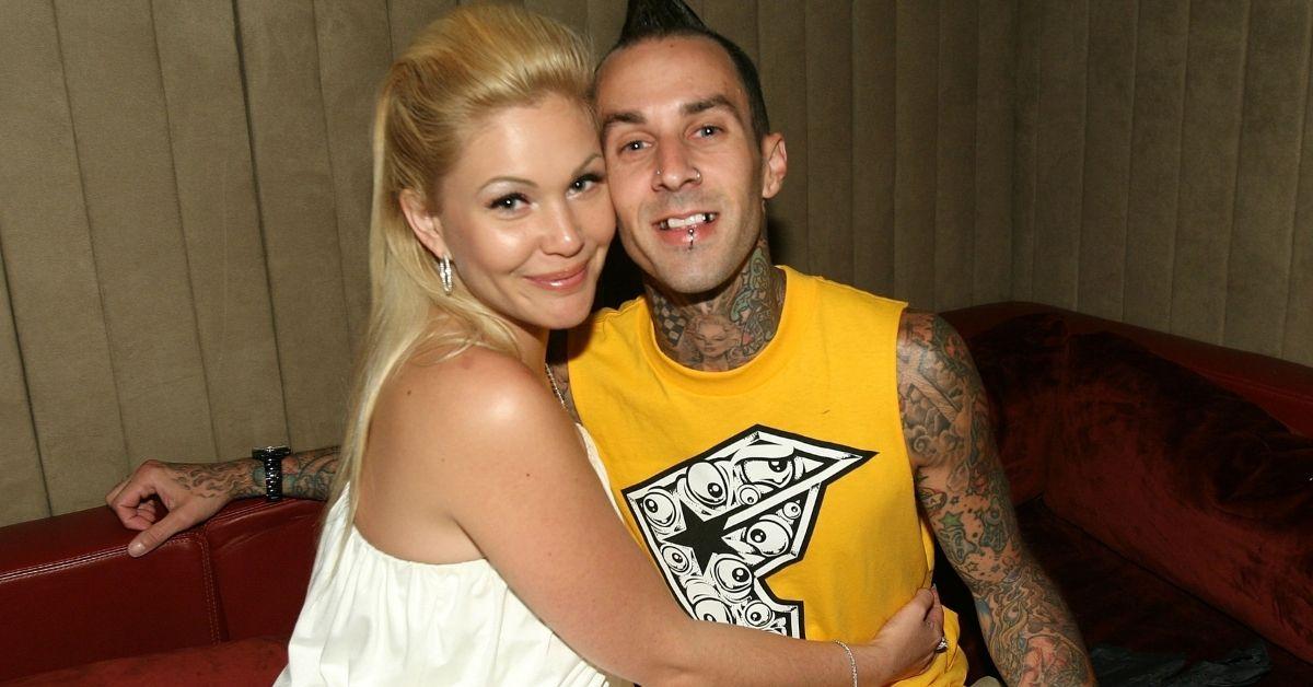 (l-r): Shanna Moakler and Travis Barker embracing at an event. 