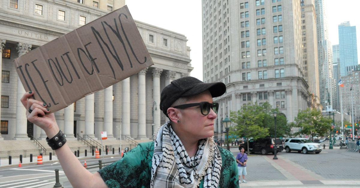 A protester holding a sign up in New York City. 