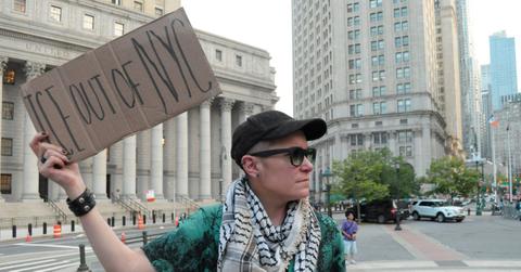 A protester holding a sign up in New York City.