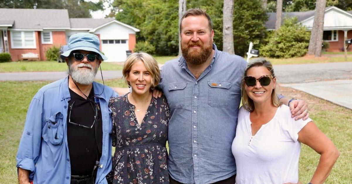 Ben, Erin, Tim, and Angie from HGTV's 'Home Town' standing arm-in-arm.