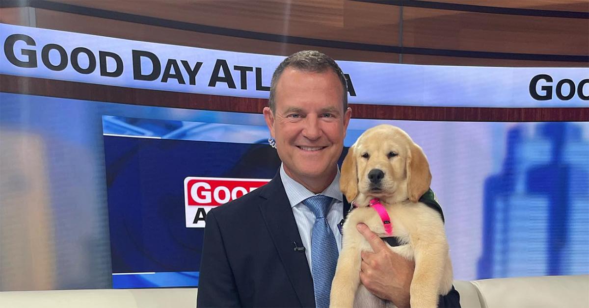 Buck Lanford with a puppy on Good Day Atlanta. 