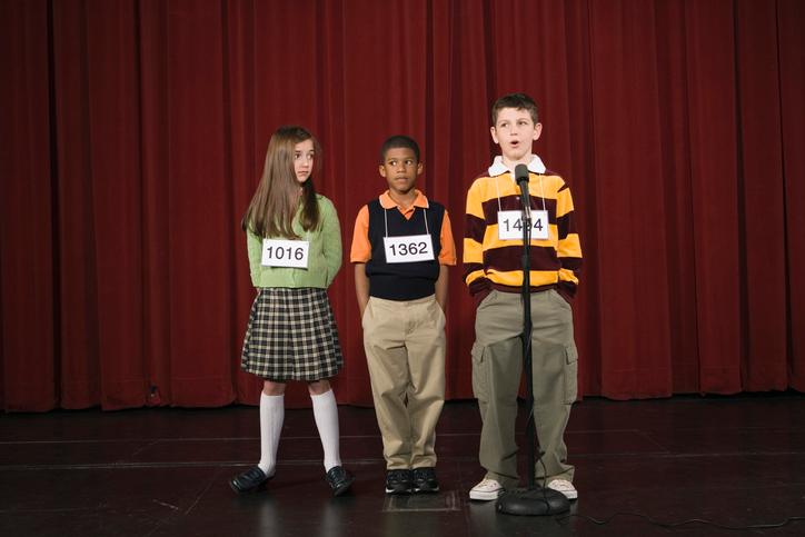 Spelling bee participants on stage