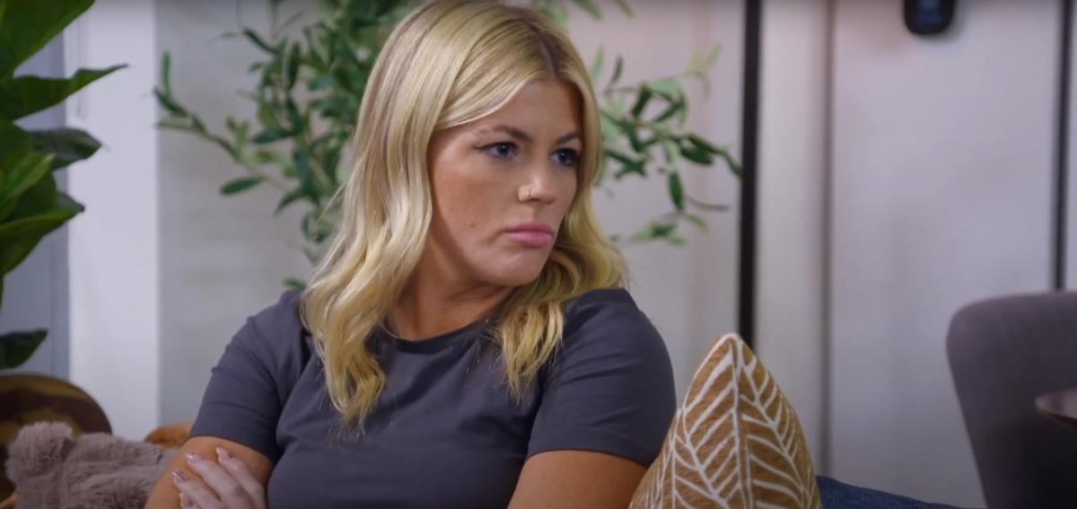 Michelle sits on a couch with David on MAFS