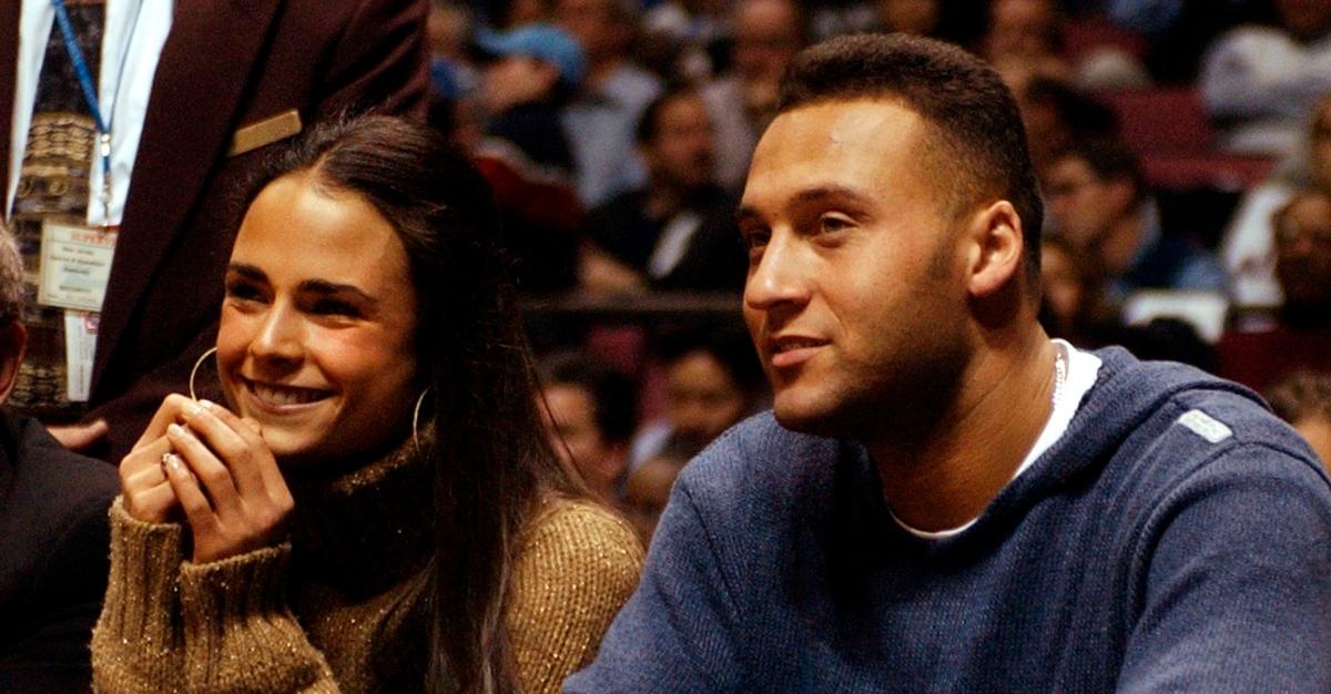 Jordana Brewster and Derek Jeter sit courtside on Dec. 19, 2002, at Continental Arena in East Rutherford, N.J.