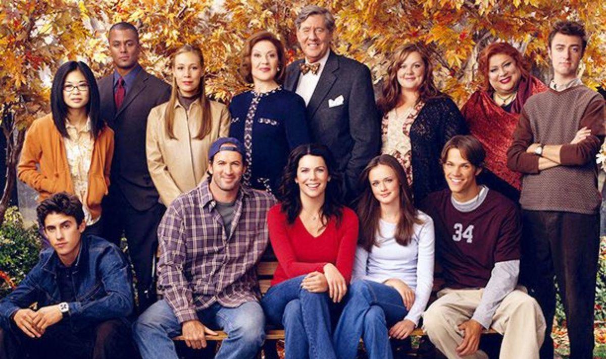 The 'Gilmore Girls' cast poses against a fall background