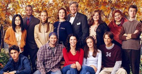 The 'Gilmore Girls' cast poses against a fall background