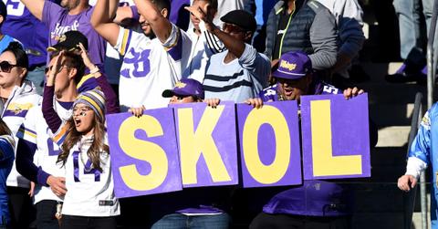 Minnesota Vikings fans hold up a sign that reads, "Skol!"